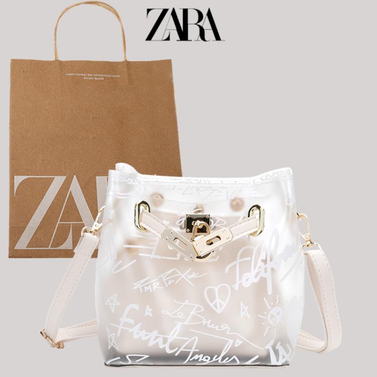 zara今年流行透明包包女包夏百搭時尚果凍包斜背包字母涂鴉水桶包 【麥田印象】