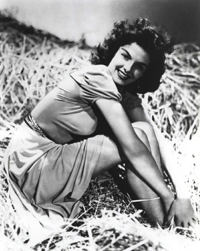 Posterazzi: Jane Russell in a hay bale Photo Print (24 x 30) | Rakuten.com