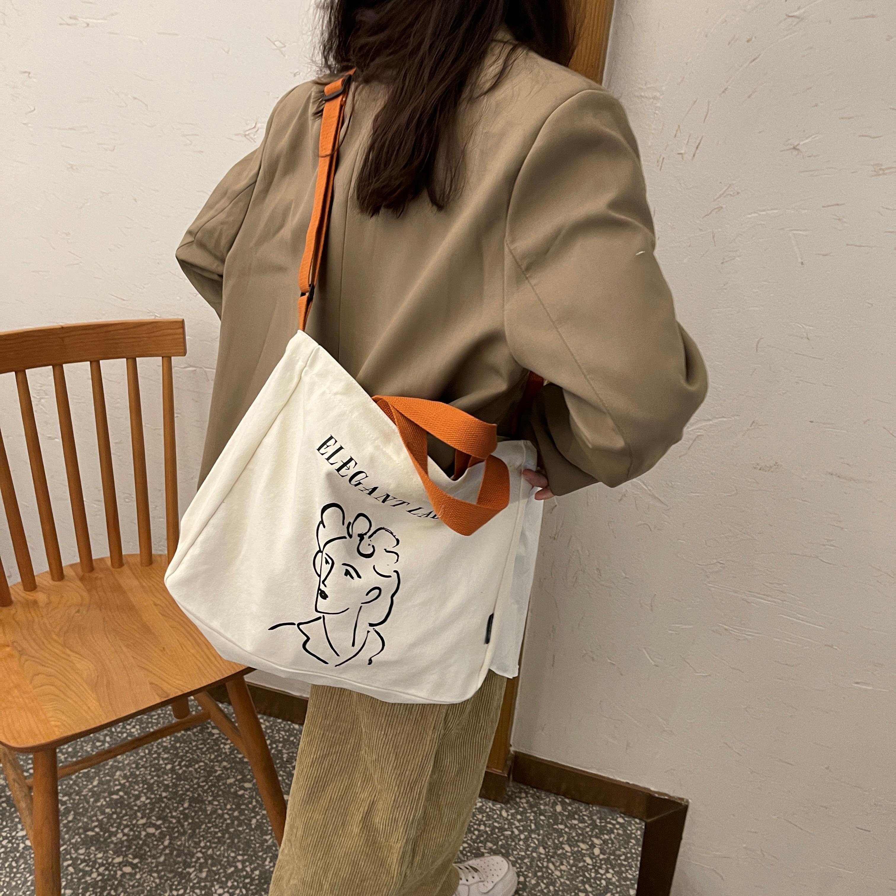 韓國小眾設計手提帆布包女 小清新休閑逛街斜挎大容量購物袋藝術