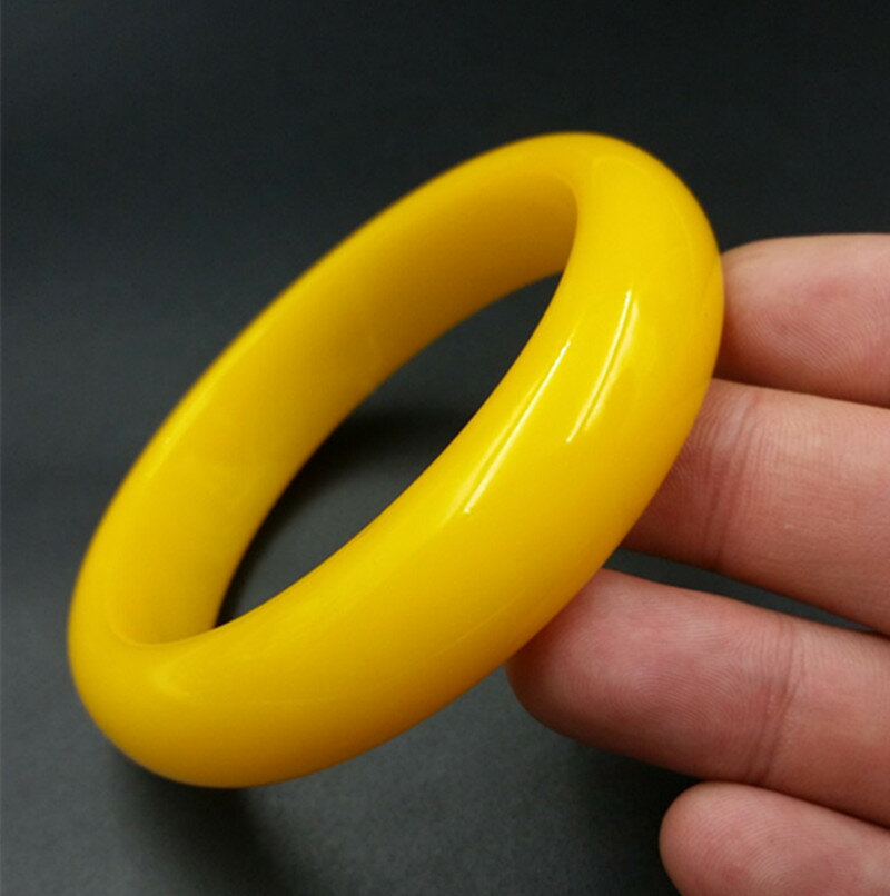 仿琥珀手鐲新款雞油黃蜜蠟琥手鐲黃色手鐲女款鐲子廠家直銷現貨