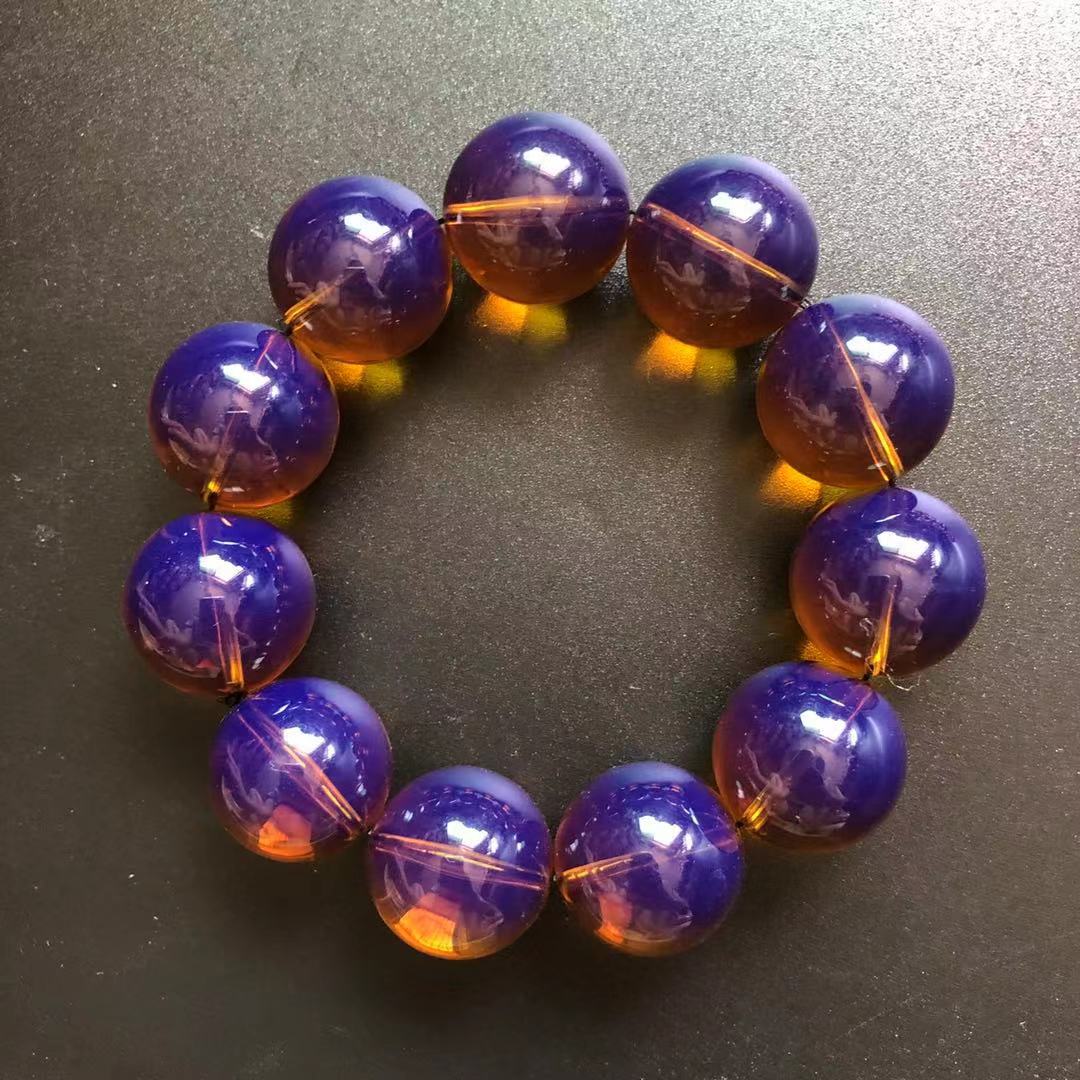 琥珀蜜蠟金棕珀紫羅蘭單圈圓珠手串浮鹽水有熒光遇自然光黑底變色