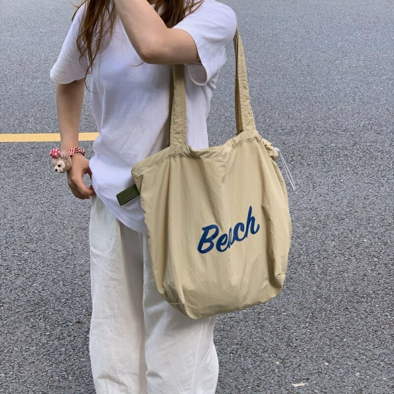 單肩通勤包字母托特包百搭慵懶風帆布包女2024新款簡約抽繩大容量【步行者戶外生活館】
