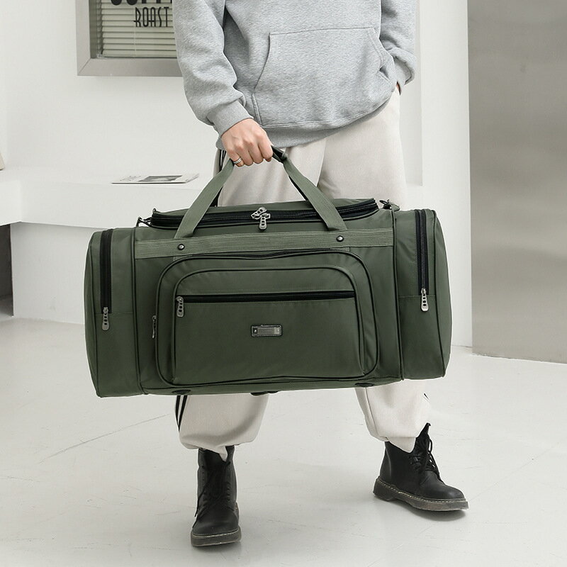 旅行包男士大容量手提超大號出差旅游登機單肩特大打工衣物行李袋