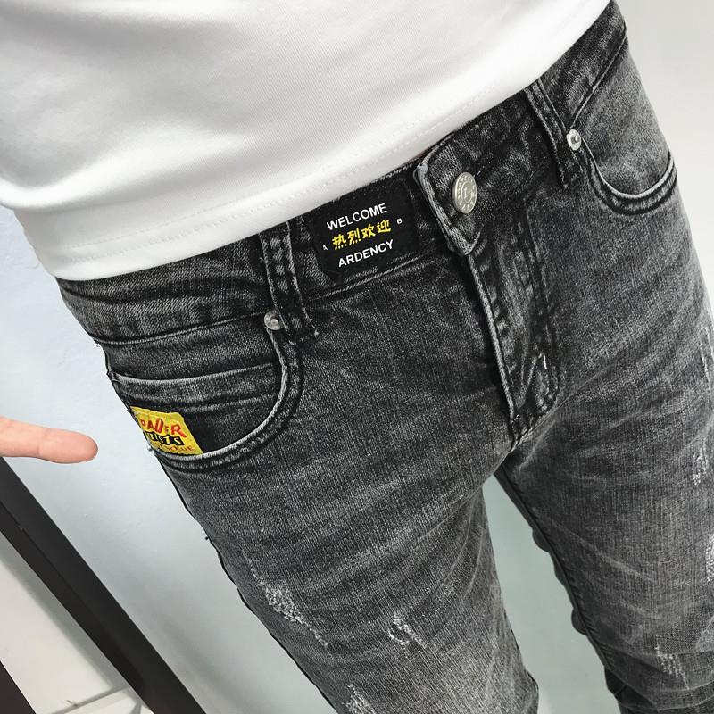 一條有腔調的黑灰牛仔褲 潮男春夏新韓修身貼標小腳長褲社會青年