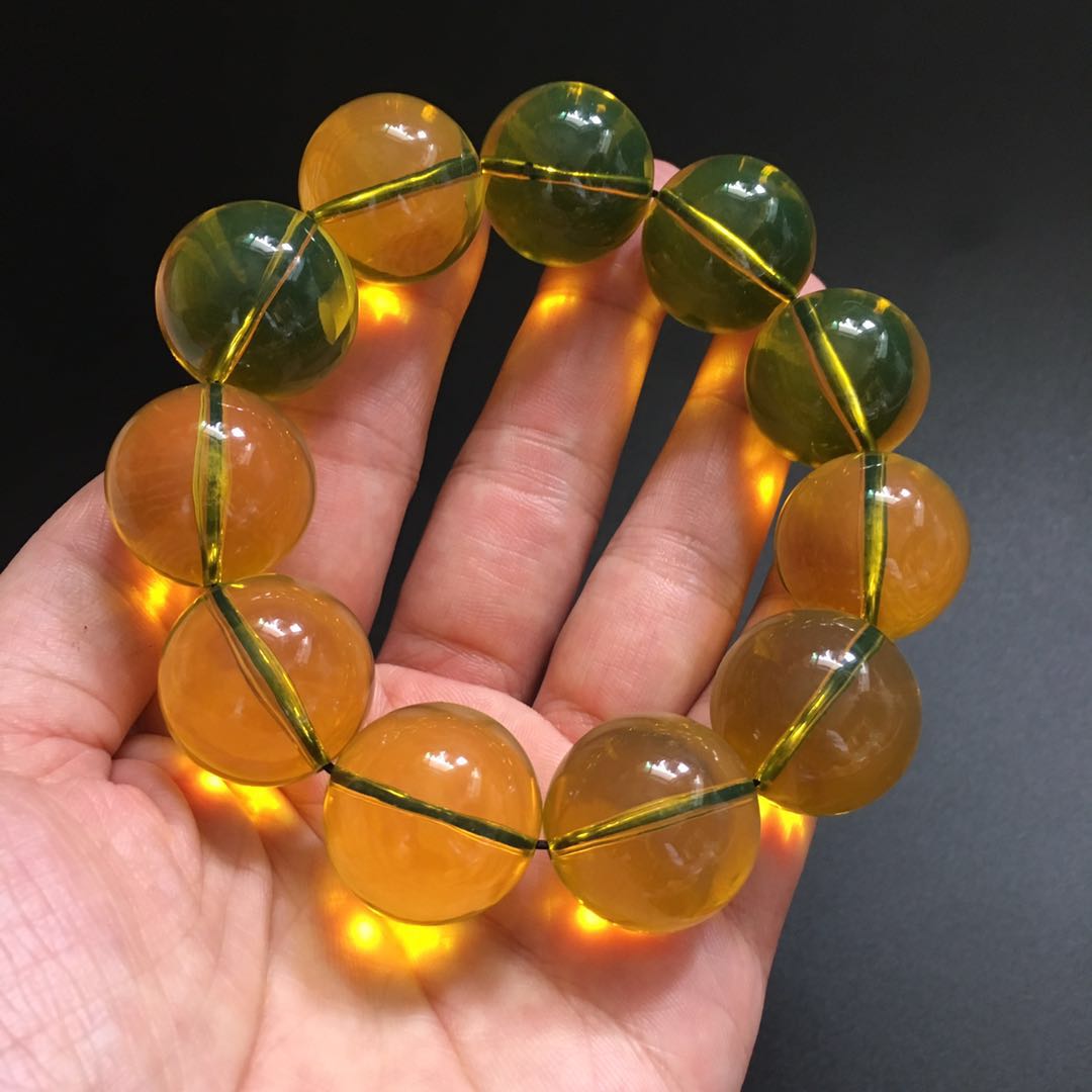 仿二代琥珀蜜蠟墨西哥凈水藍珀圓珠單圈手串黑底變色浮鹽水有熒光