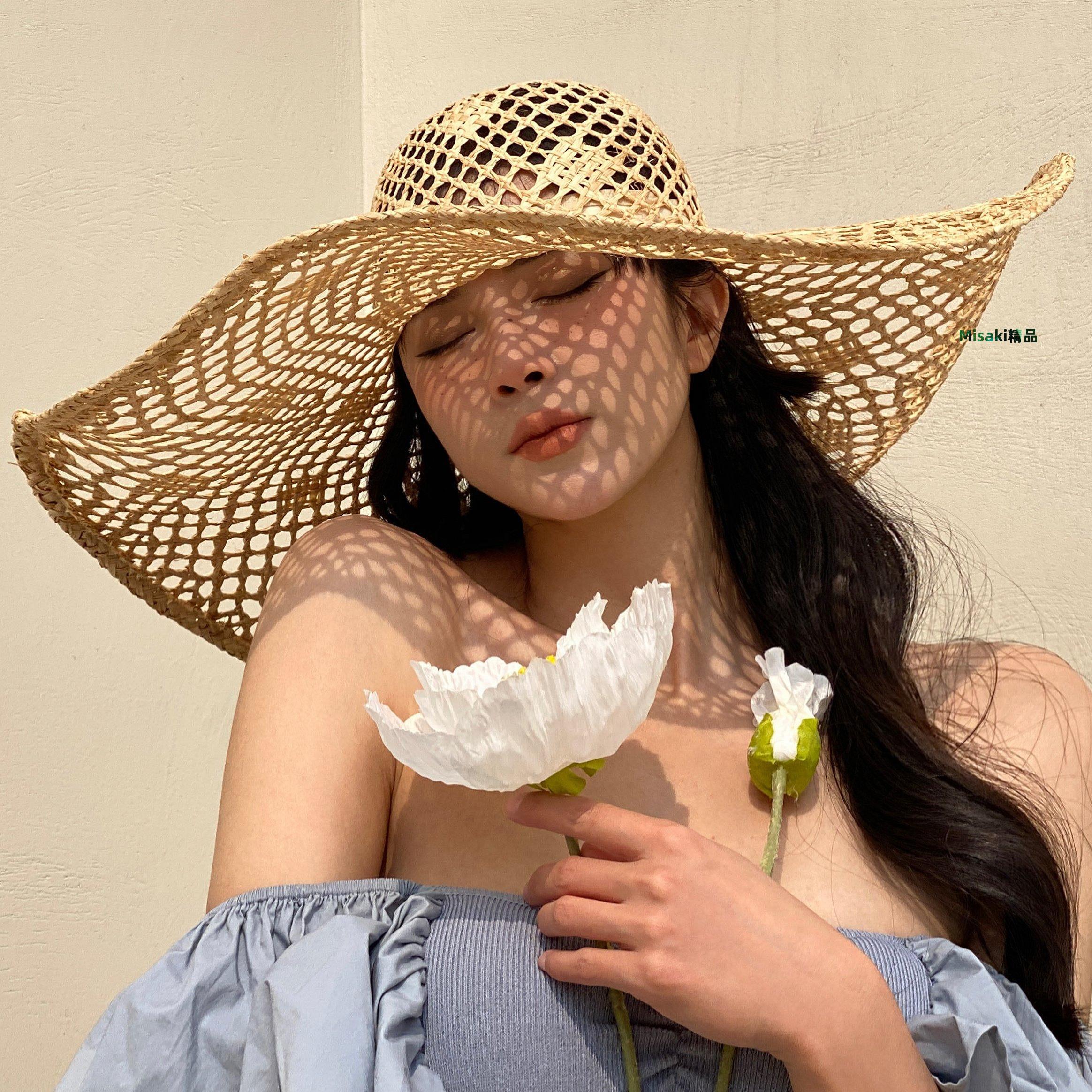 草帽 歐美風格春夏新款鏤空手工編織大簷拉菲草帽出遊遮陽度假沙灘帽女~熱銷-Misaki精品
