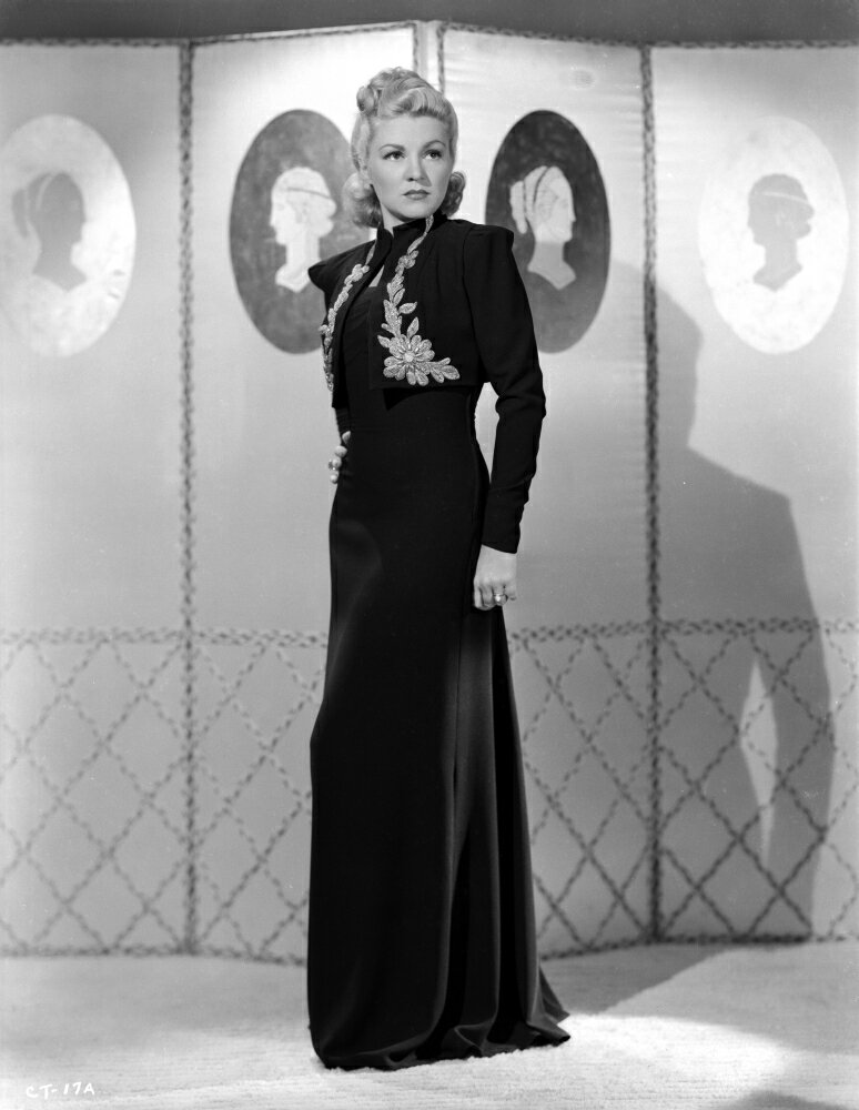 Posterazzi: Claire Trevor standing in Black Dress Photo Print (8 x 10 ...